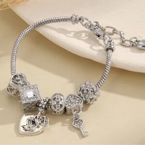 Chic Silver Charm Bracelet with Heart and Key Accents